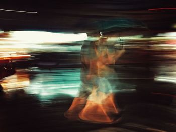 Blurred motion of man at night