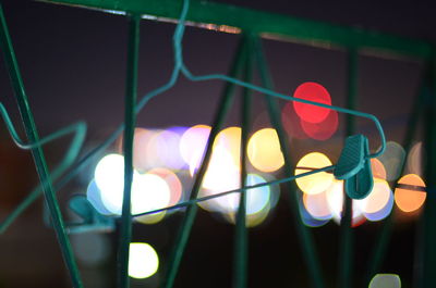 Close-up of illuminated lamp at night