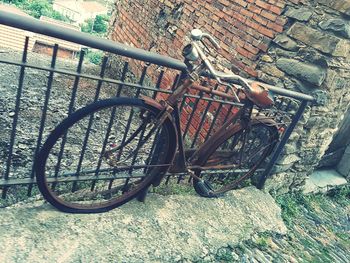 Bicycle parked on wall