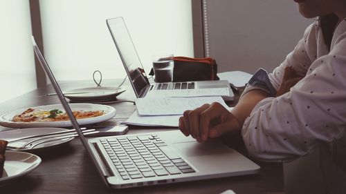 Man using laptop on table