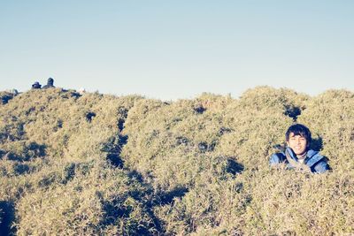 Portrait of man against clear sky