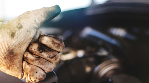 Close-up of man holding car