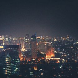 Illuminated cityscape at night