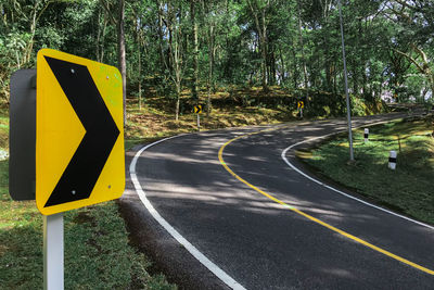 Road traffic symbols curved right to reduced speed