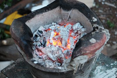 Close-up of burning coal in stove
