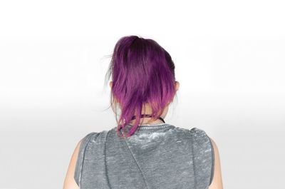 Rear view of woman against white background