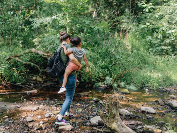 Full length of woman in forest