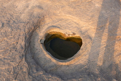 High angle view of hole on rock