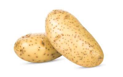 Close-up of bananas against white background