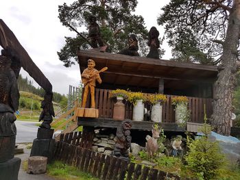 Low angle view of statues against sky