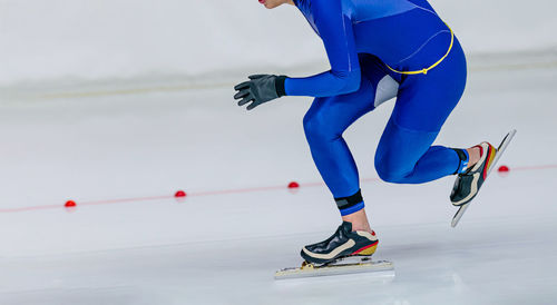 Athlete speed skater run in ice skating competition