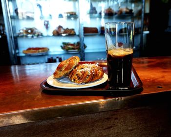 Cinnamon buns and black coffee cafe counter