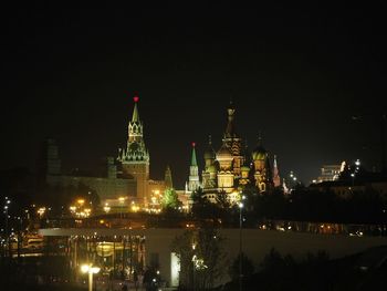 Illuminated buildings in city at night