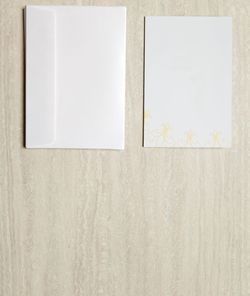 Close-up of white paper on wall