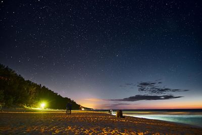 Scenic view of sea against sky at night