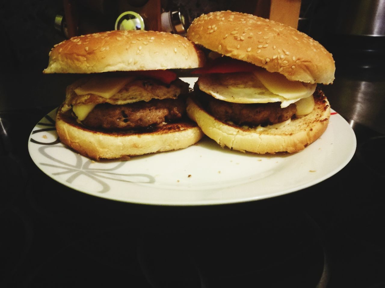 food and drink, food, burger, unhealthy eating, hamburger, bun, ready-to-eat, indoors, table, fast food, indulgence, freshness, bread, plate, no people, close-up, black background, day