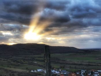 Scenic view of dramatic sky over land