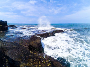 Waves splashing on rocks