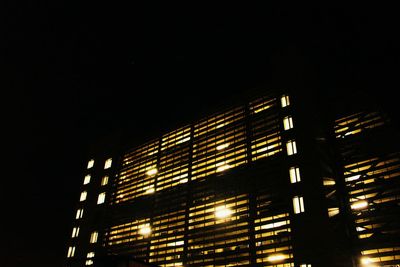 Low angle view of illuminated building at night