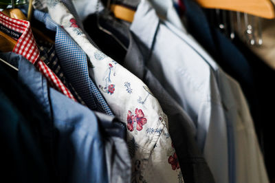 Close-up of clothes hanging on display in store