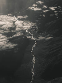 Low angle view of rocks in sea against sky