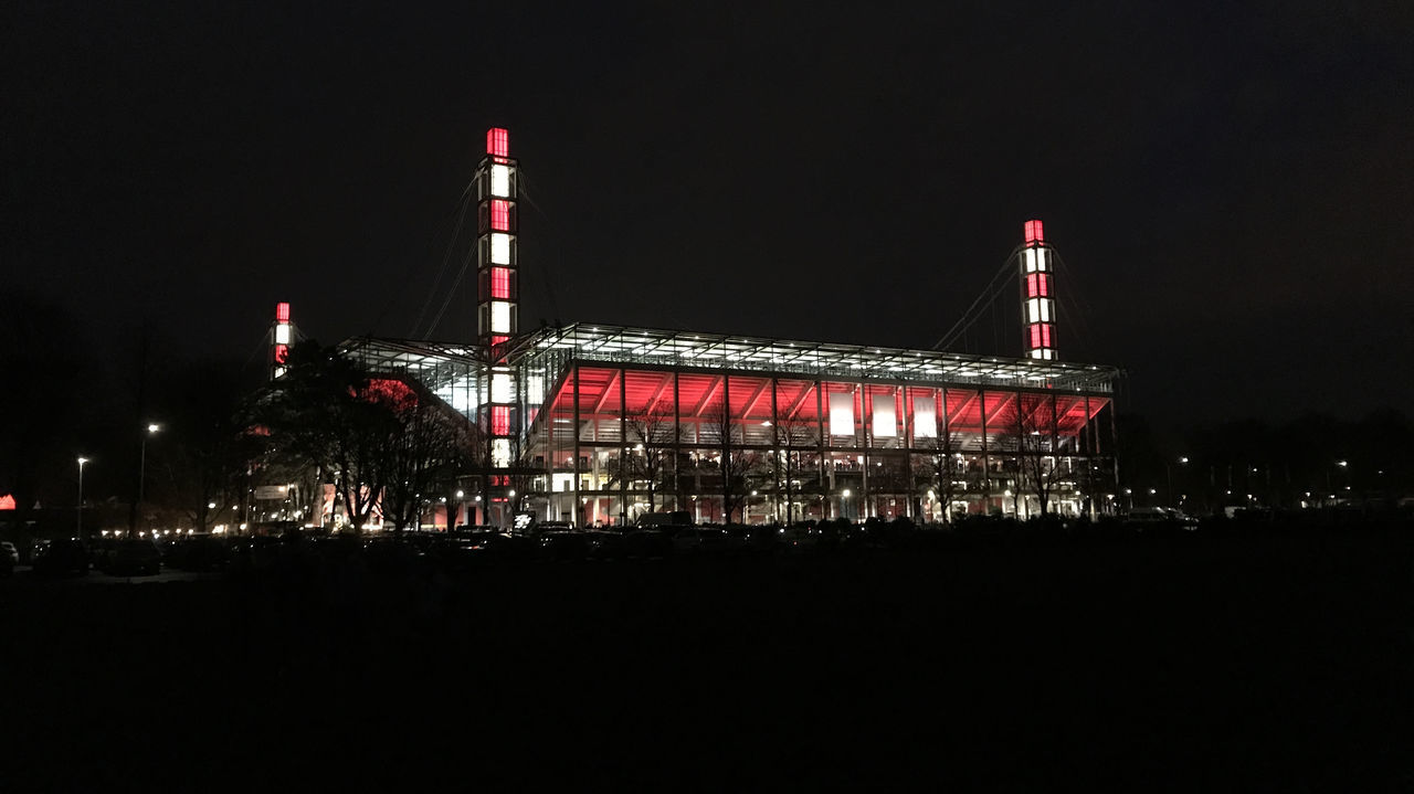 VIEW OF ILLUMINATED BUILDINGS AT NIGHT