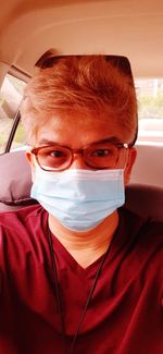 Close-up portrait of man wearing sunglasses