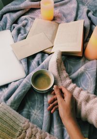 High angle view of man holding coffee cup