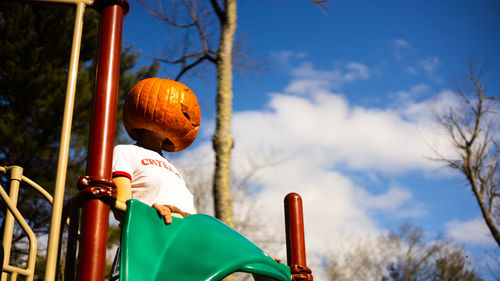 Low angle view of man standing against sky