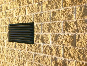 Brick wall with metal grate
