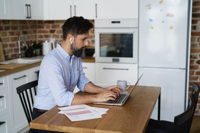 Businessman using laptop on table