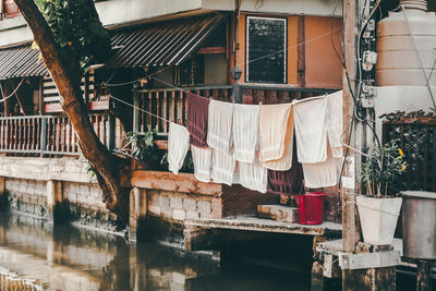 Clothes drying on clothesline against building