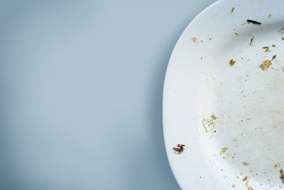 Stained dishes on table with copy space, empty food plates after eating