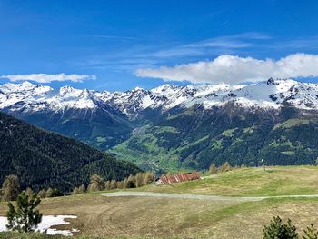 Scenic view of snowcapped mountains against sky