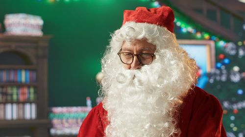Portrait of woman wearing santa hat