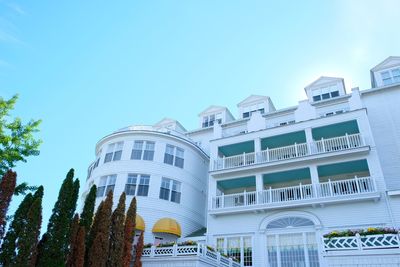 Low angle view of buildings against blue sky