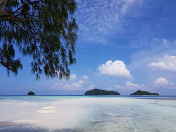 Scenic view of sea against blue sky