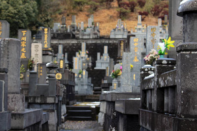 View of cemetery against buildings