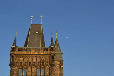 Low angle view of historical building against clear blue sky