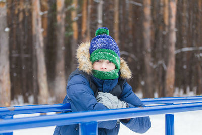 Portrait of boy wearing hat during winter