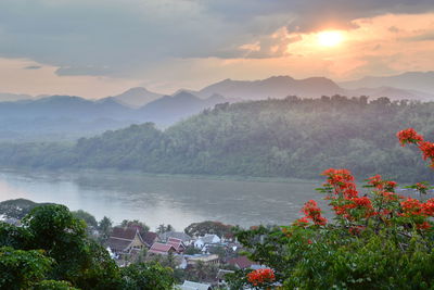 Scenic view of lake against sky during sunset