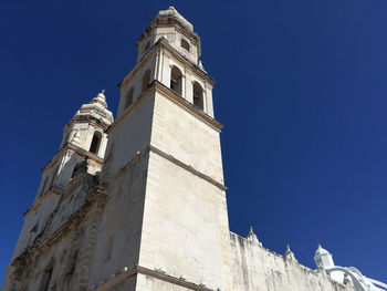 Low angle view of building against clear blue sky