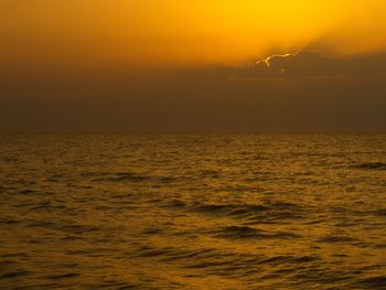 Scenic view of sea at sunset