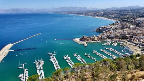 High angle view of sea and cityscape