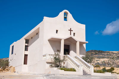 White building against blue sky