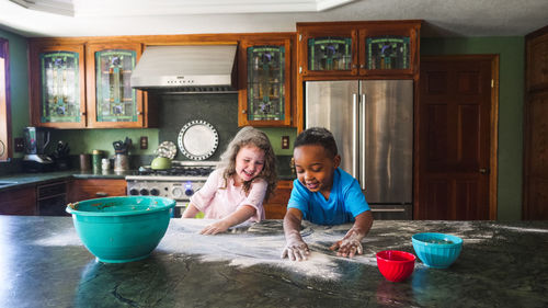 Kids making a mess in the kitchen