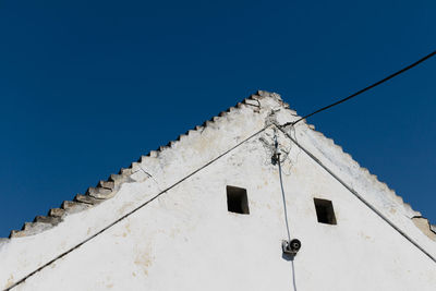 Low angle view of building against blue sky