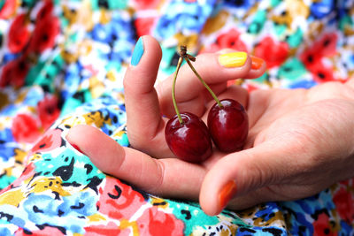 Close-up of hand holding multi colored candies