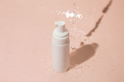 Close-up of bottle against white background