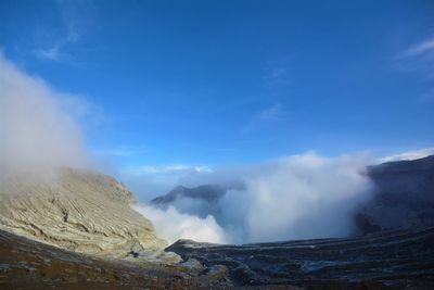 Scenic view of volcanic mountain against sky